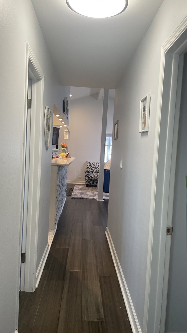 2749 Virginia Lane Glenview, IL 60025 - Photo 6 of 39 a view of hallway with wooden floor