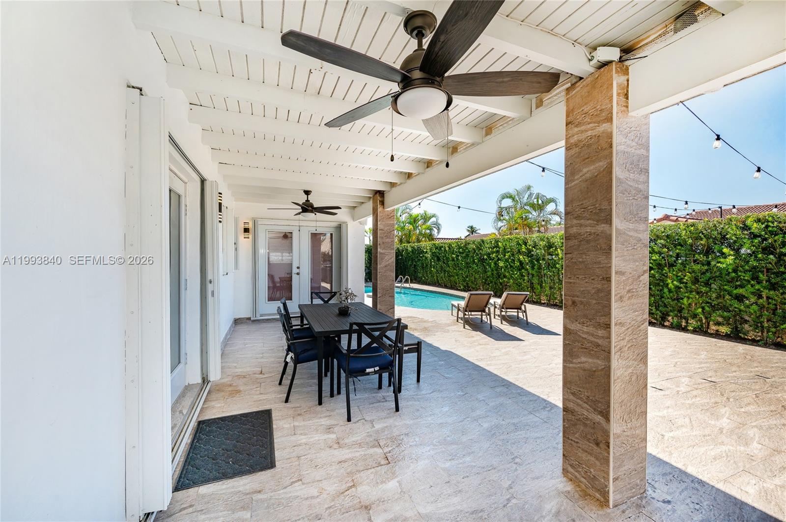 1820 Southwest 140th Place Miami, FL 33175 - Photo 15 of 22 a view of a patio with a table and chairs