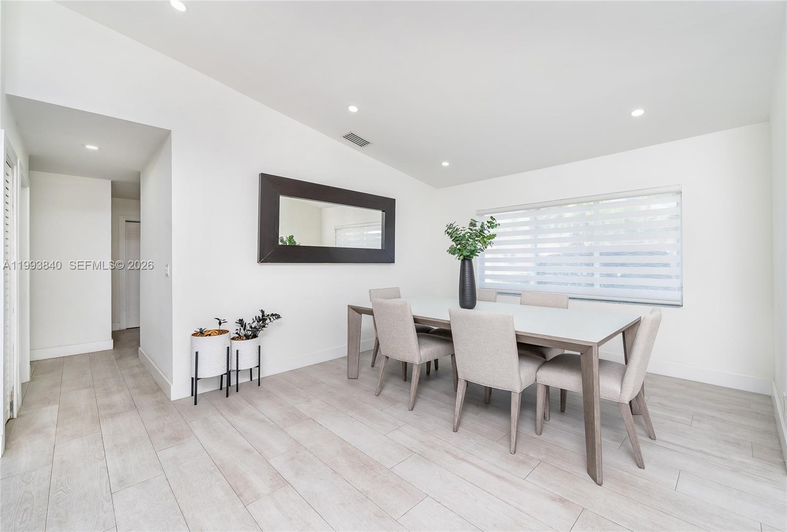 1820 Southwest 140th Place Miami, FL 33175 - Photo 7 of 22 a view of a dining room with furniture and wooden floor