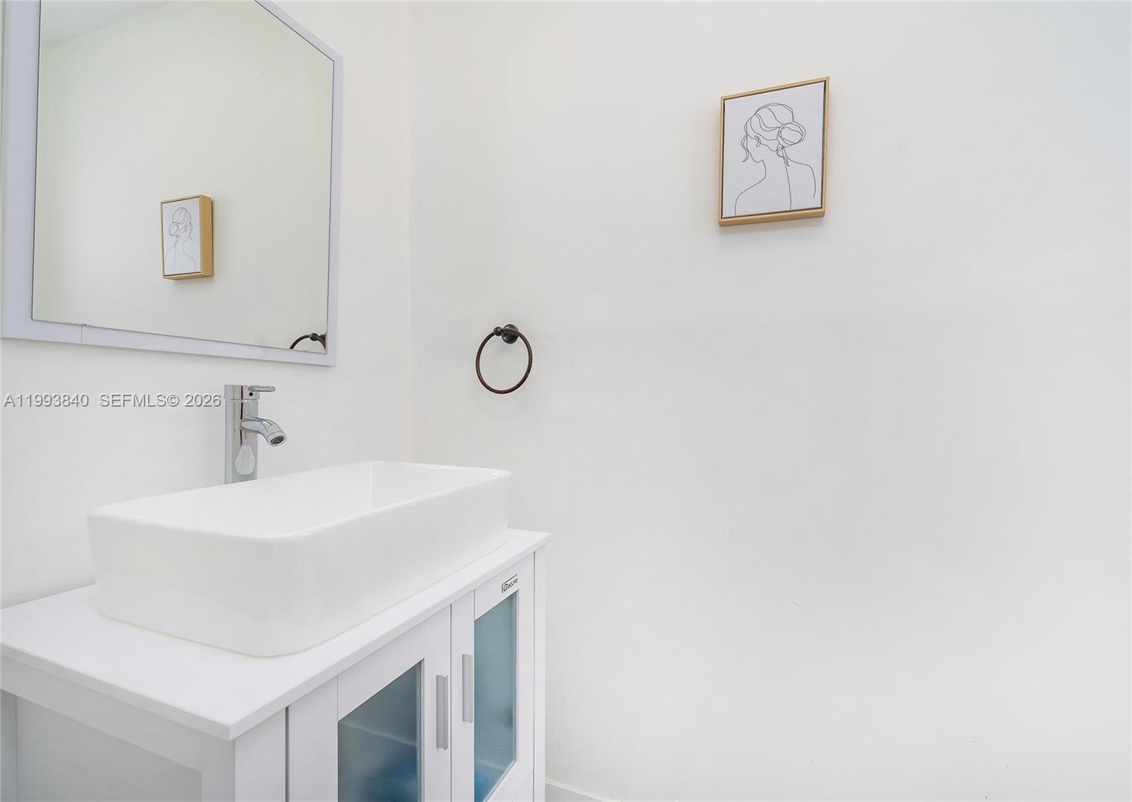 1820 Southwest 140th Place Miami, FL 33175 - Photo 10 of 22 a bathroom with a sink and a mirror