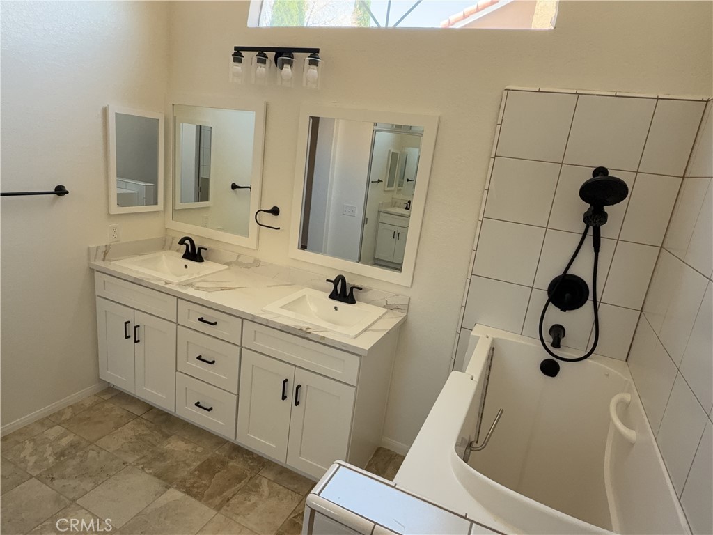 12590 Cobalt Road Victorville, CA 92392 - Photo 32 of 37 a bathroom with a sink and mirror