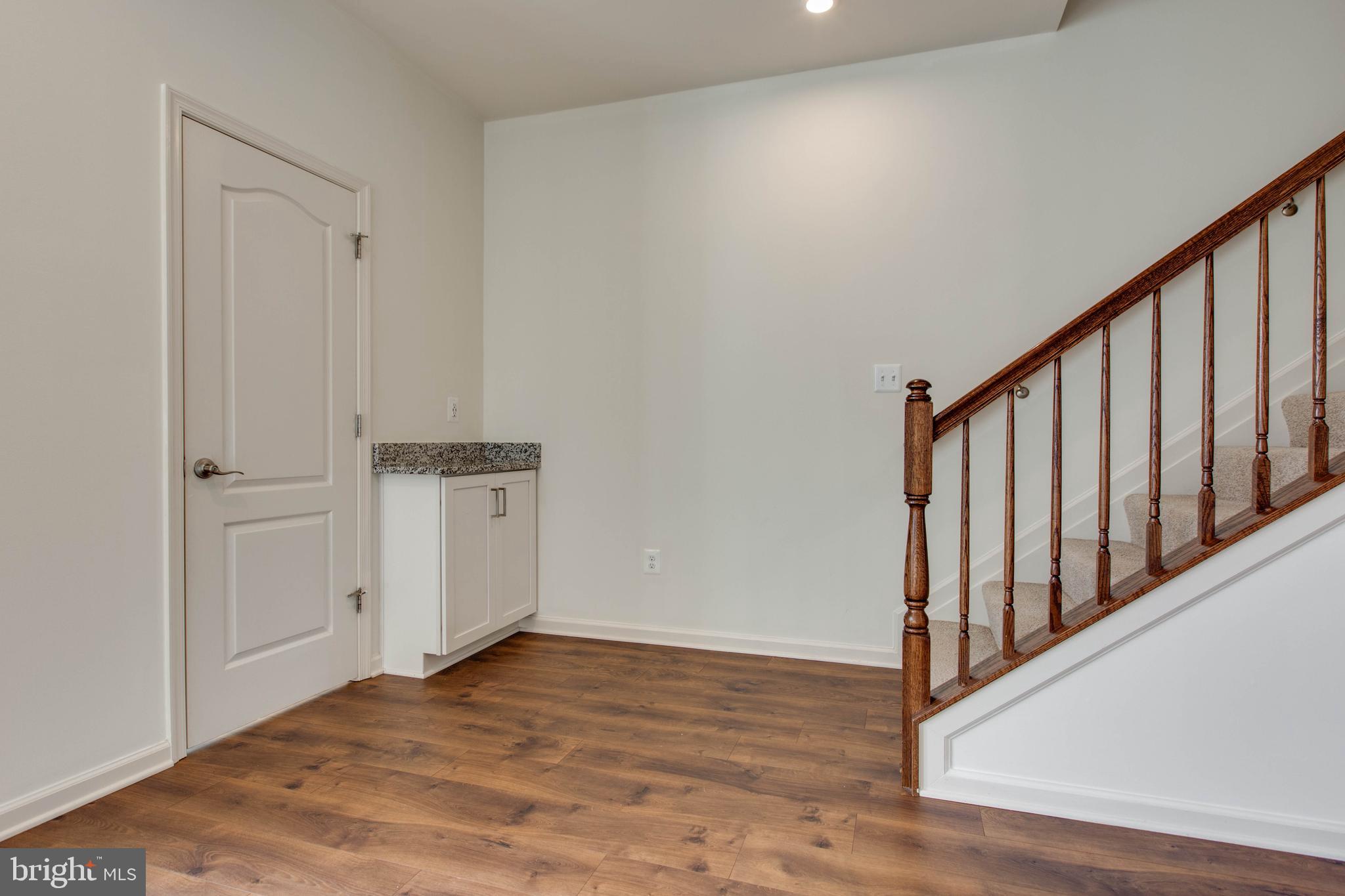 1922 Red Jasper Road Hanover, MD 21076 - Photo 11 of 49 a view of a hallway with wooden floor and entryway
