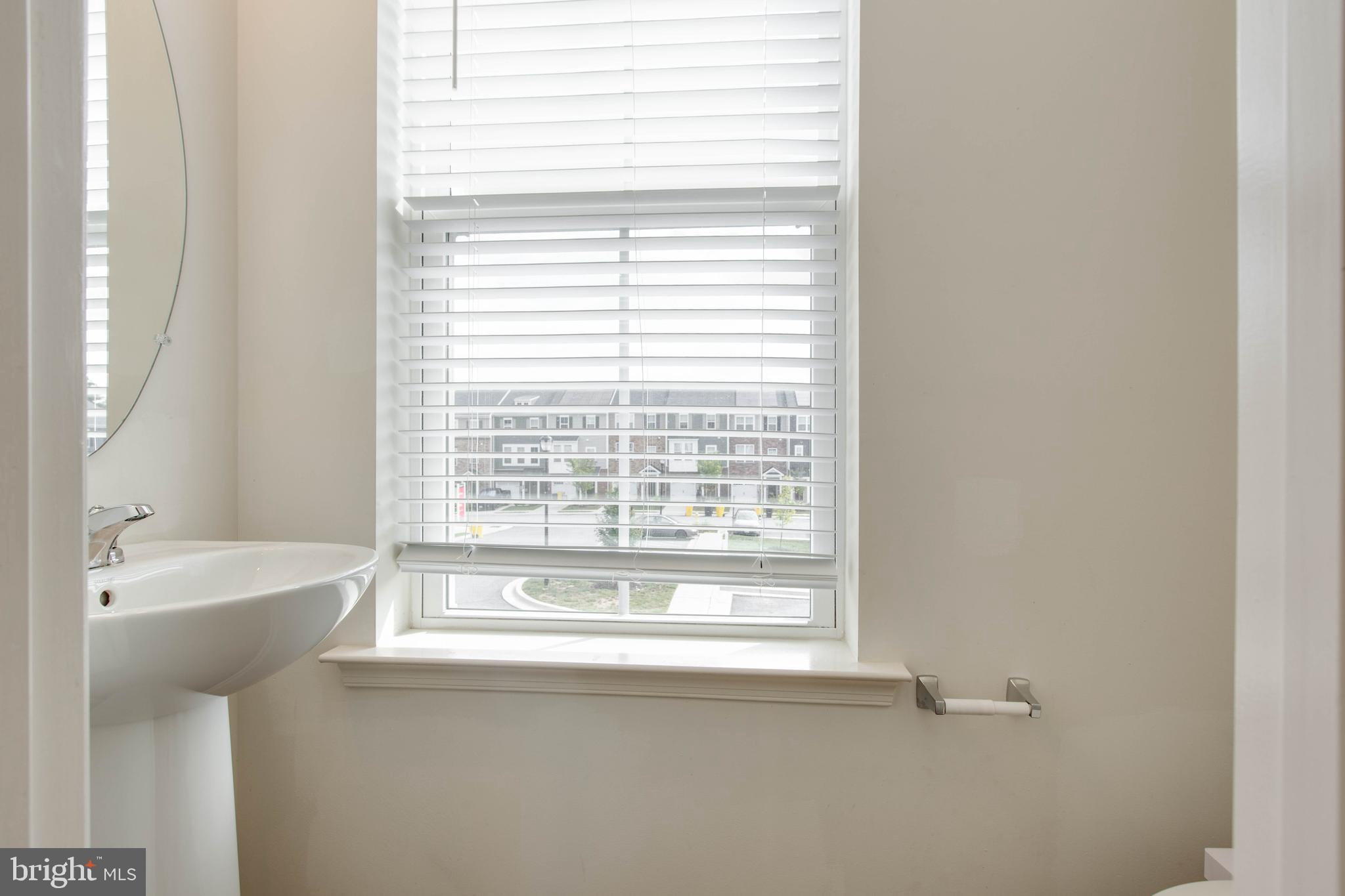 1922 Red Jasper Road Hanover, MD 21076 - Photo 12 of 49 a bathroom with a bathtub and a sink
