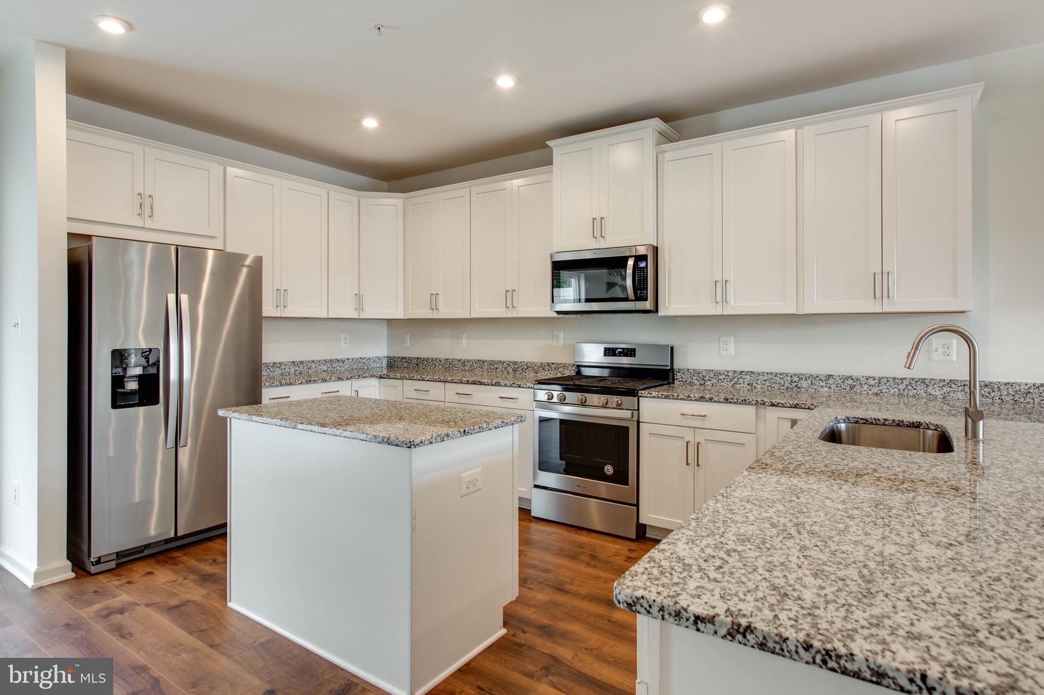 1922 Red Jasper Road Hanover, MD 21076 - Photo 14 of 49 a kitchen with stainless steel appliances granite countertop a refrigerator stove microwave and sink