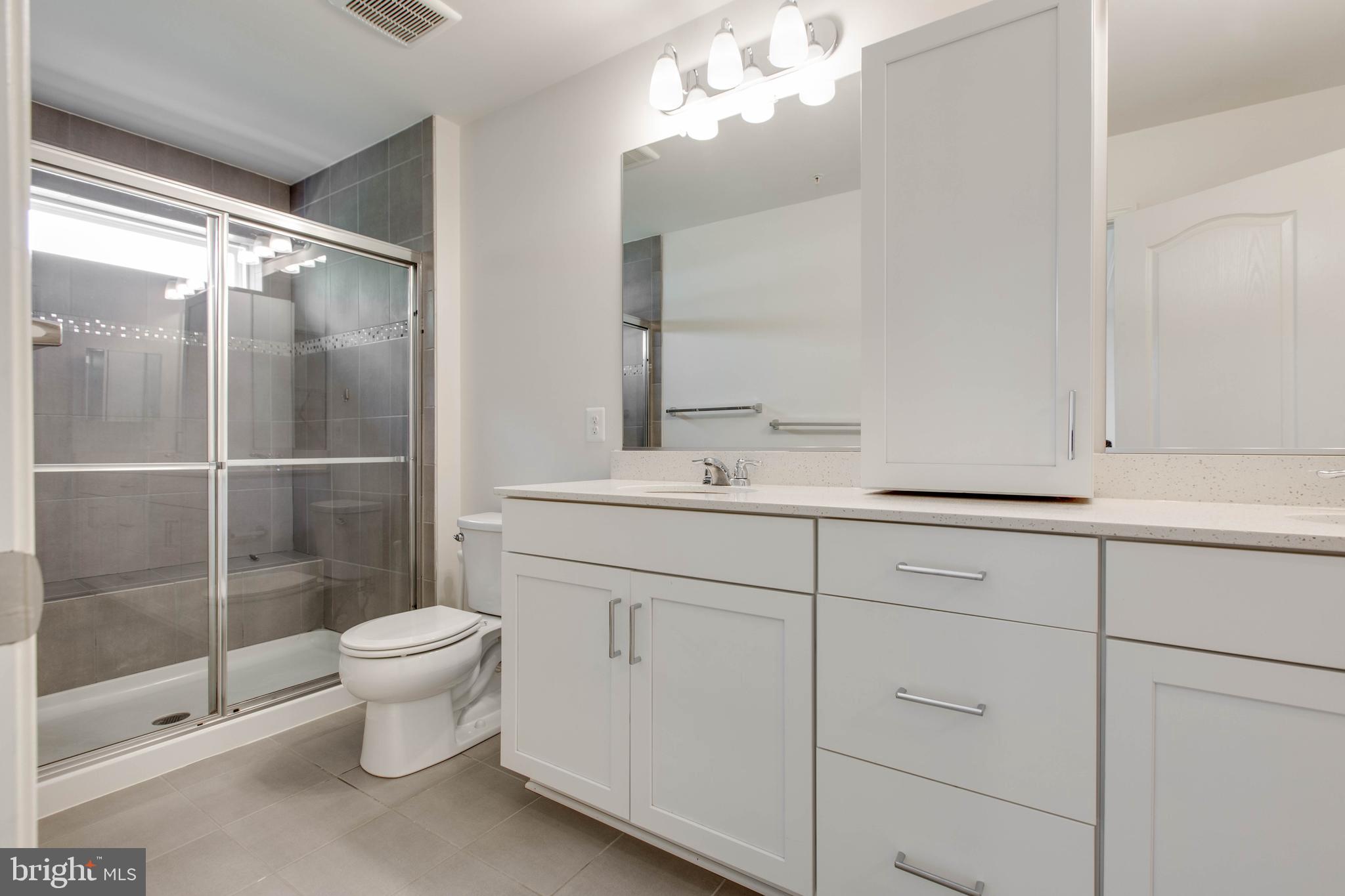 1922 Red Jasper Road Hanover, MD 21076 - Photo 26 of 49 a bathroom with a sink a toilet and shower