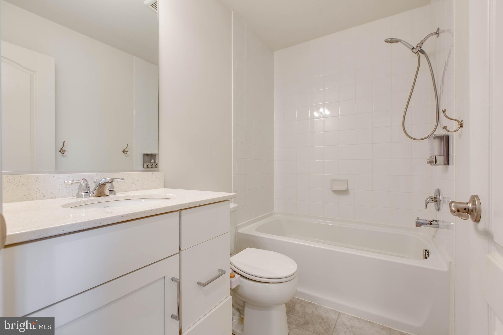 1922 Red Jasper Road Hanover, MD 21076 - Photo 34 of 49 a bathroom with a sink a toilet and shower