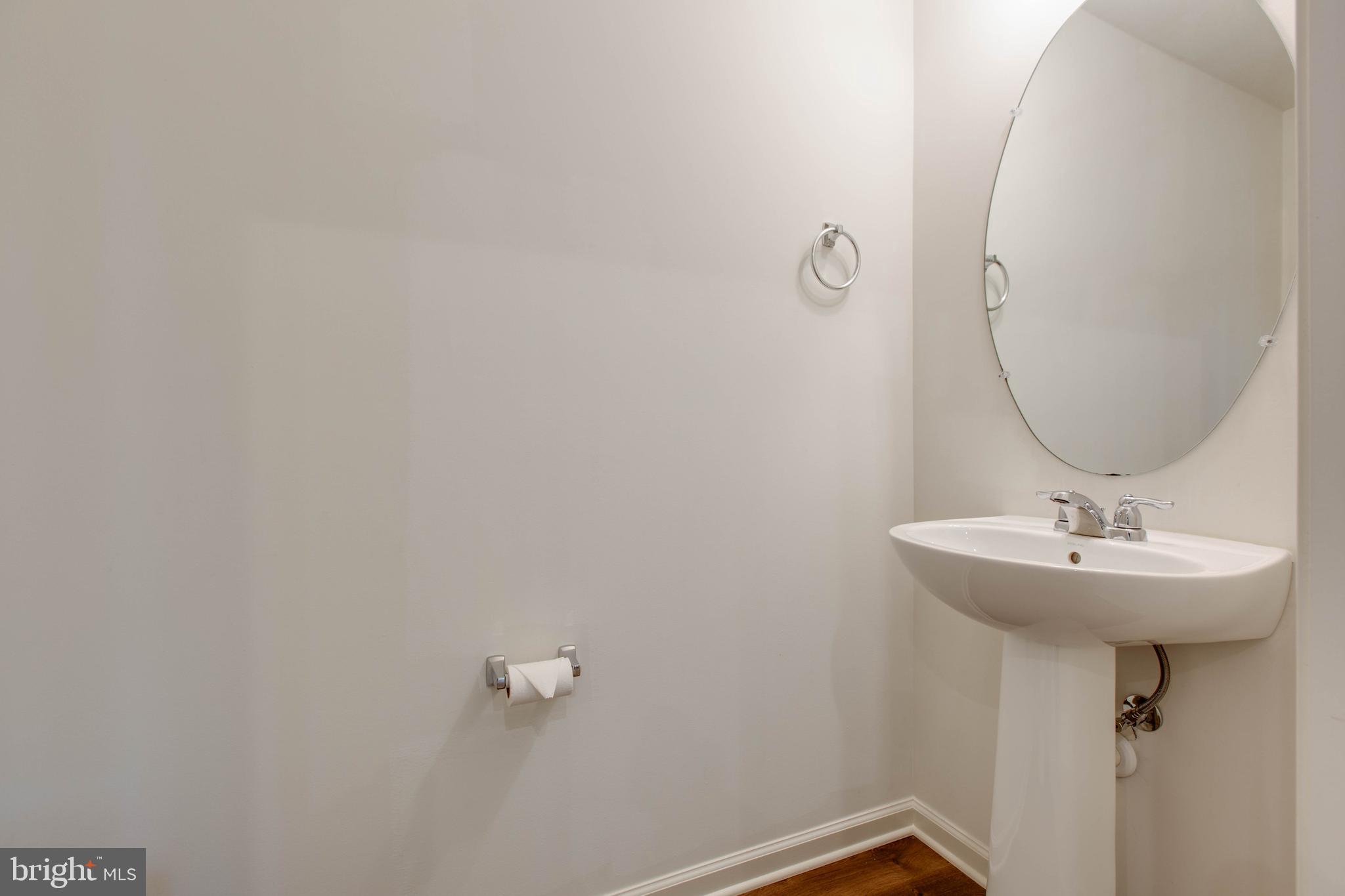 1922 Red Jasper Road Hanover, MD 21076 - Photo 37 of 49 a bathroom with a sink a mirror and vanity