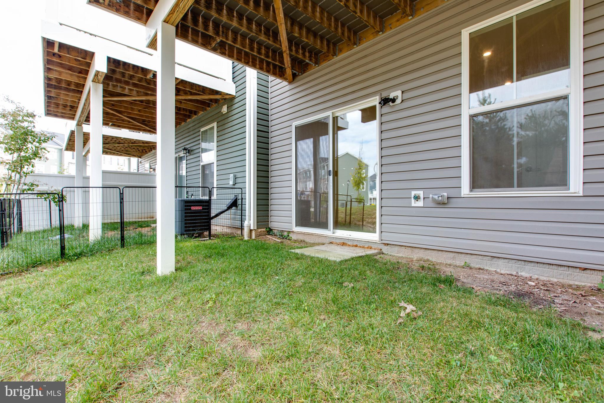 1922 Red Jasper Road Hanover, MD 21076 - Photo 44 of 49 a view of a backyard with plants and large tree