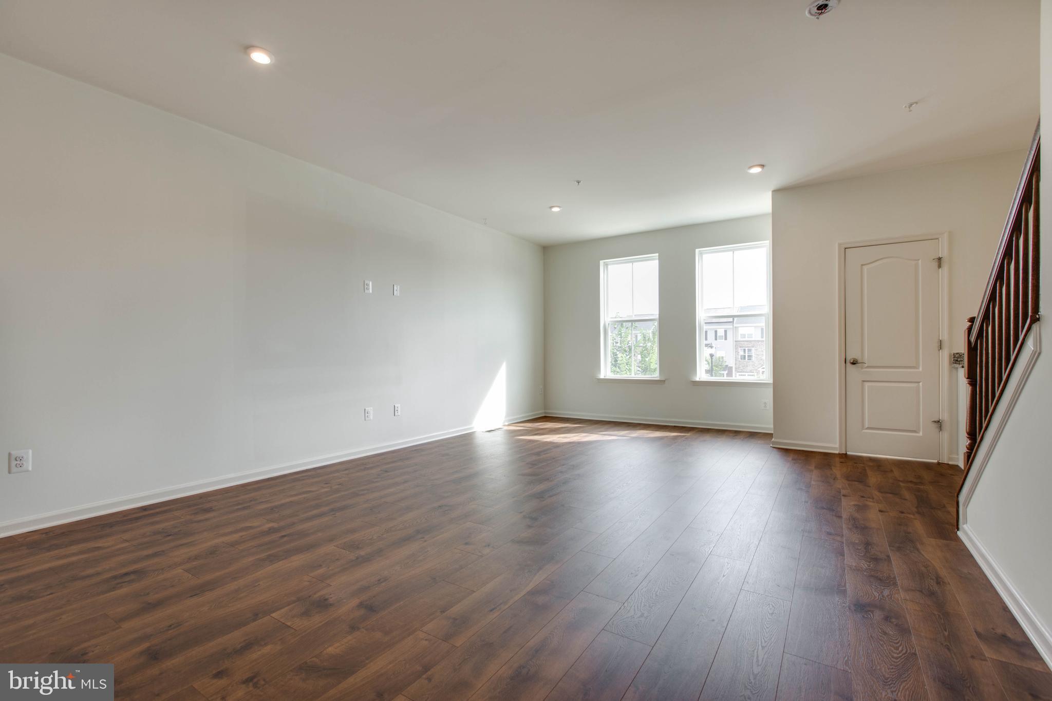 1922 Red Jasper Road Hanover, MD 21076 - Photo 7 of 49 an empty room with wooden floor and windows