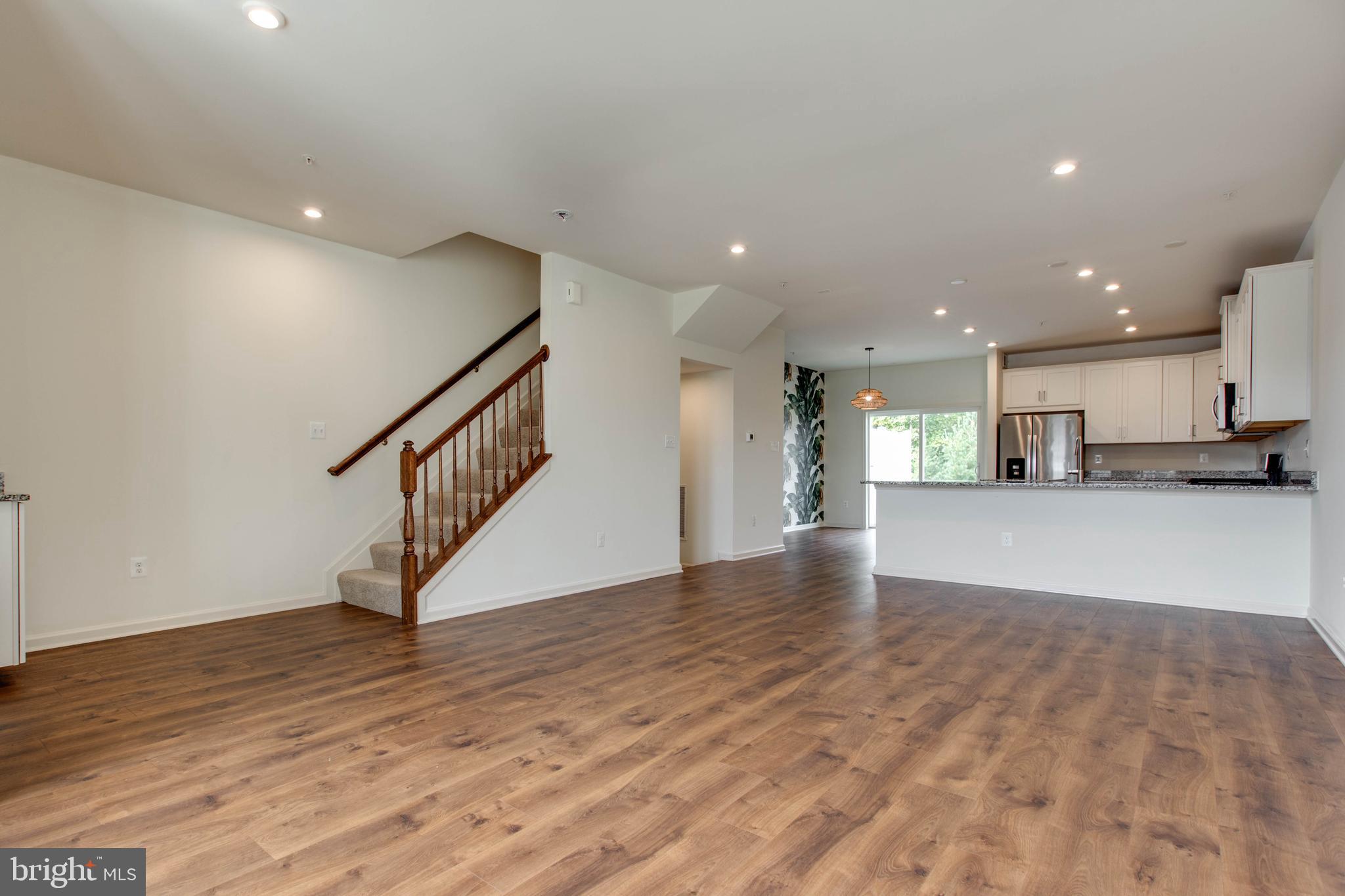 1922 Red Jasper Road Hanover, MD 21076 - Photo 9 of 49 a view of an empty room with wooden floor