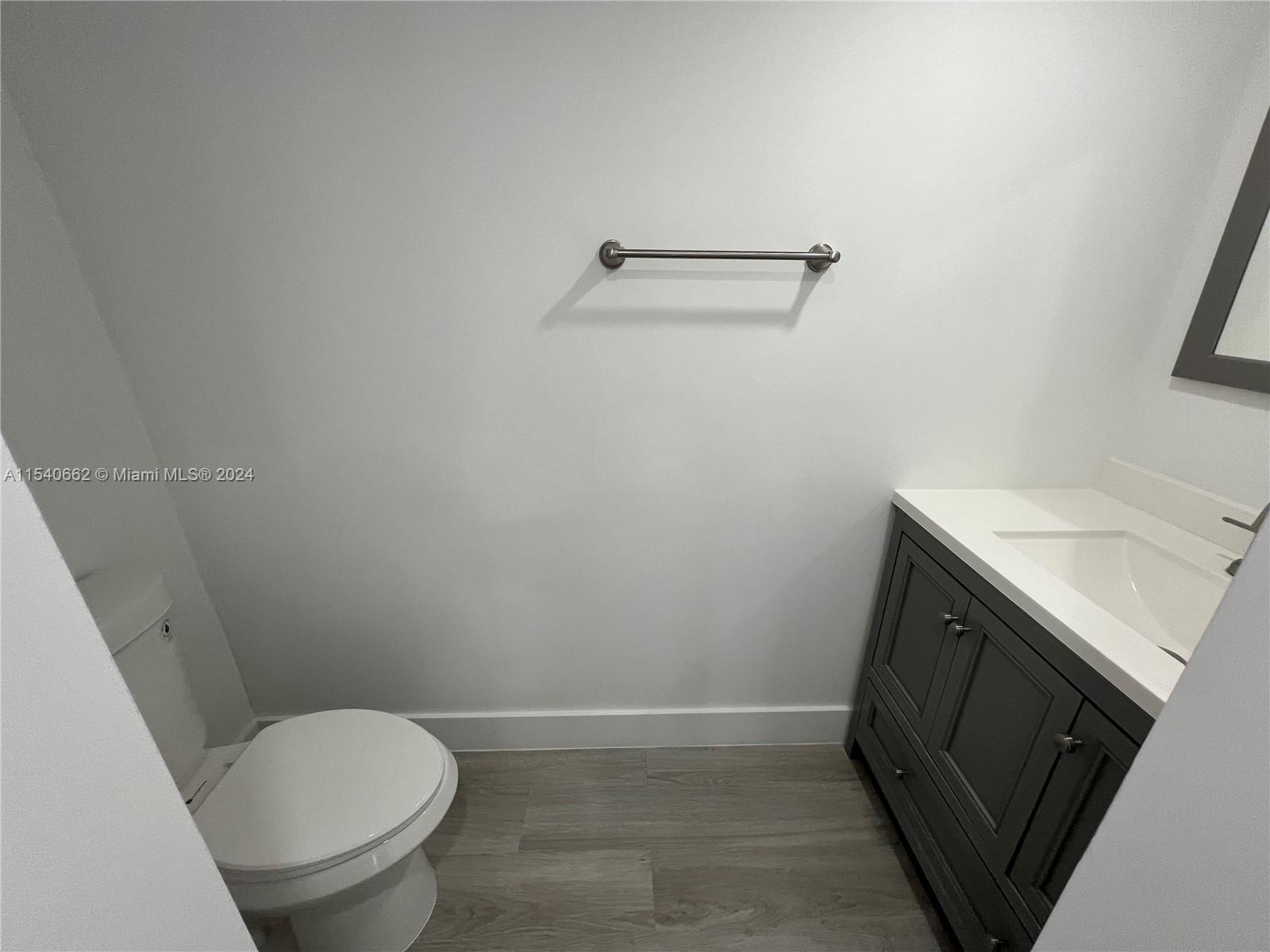 14155 Southwest 87th Street, Unit E108 Miami, FL 33183 - Photo 9 of 9 a bathroom with a sink and a toilet