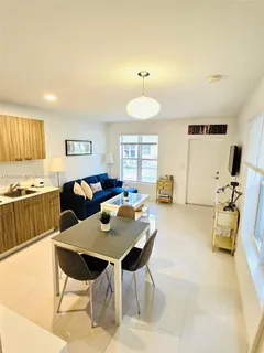 a living room with furniture and a table