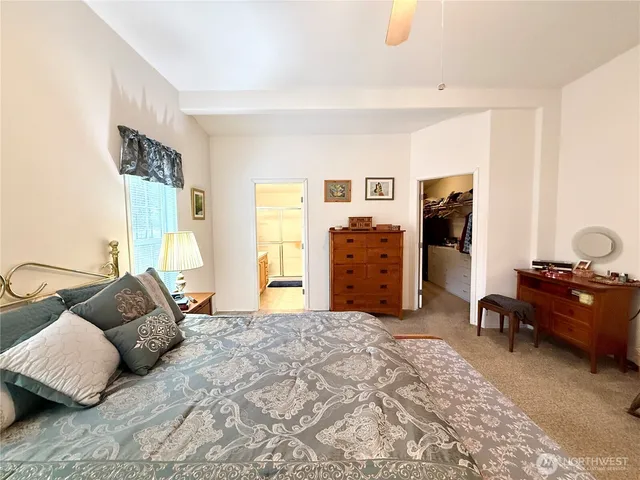 a bedroom with furniture and window