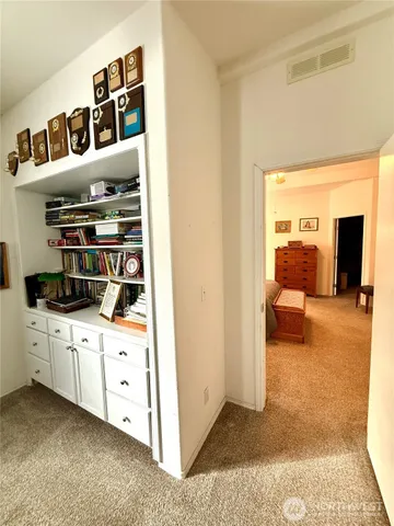 a room with furniture and a book shelf