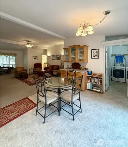 a living room with lots of furniture and a chandelier