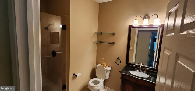a bathroom with a mirror and a sink