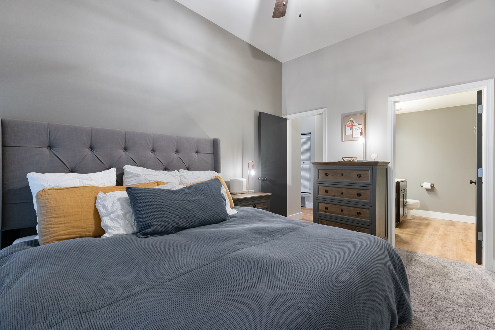 1250 South Indiana Avenue, Unit 101 Chicago, IL 60605 - Photo 11 of 16 a bedroom with a bed and dresser