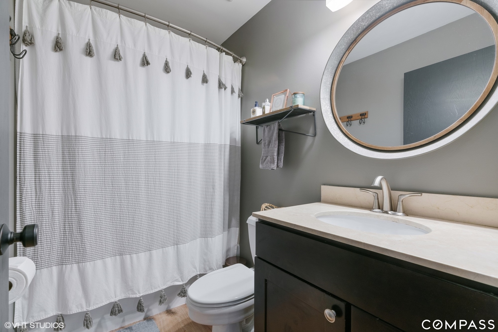 1250 South Indiana Avenue, Unit 101 Chicago, IL 60605 - Photo 15 of 16 a bathroom with a sink toilet and shower
