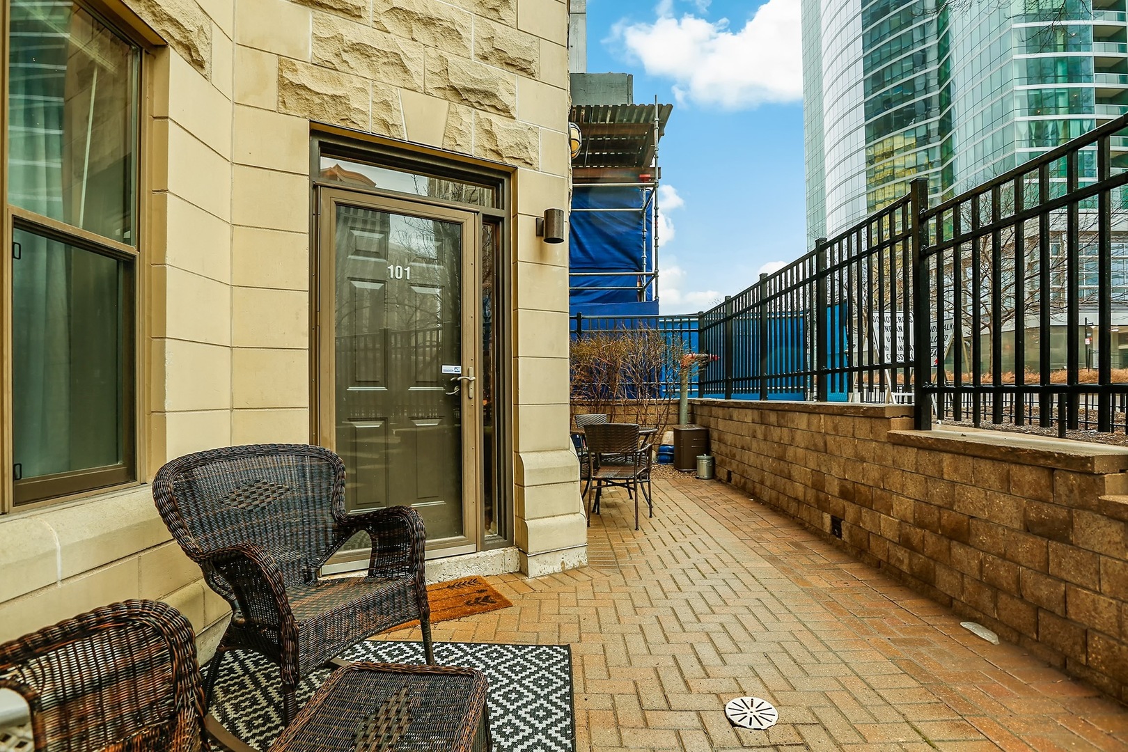 1250 South Indiana Avenue, Unit 101 Chicago, IL 60605 - Photo 16 of 16 a balcony with table and chairs