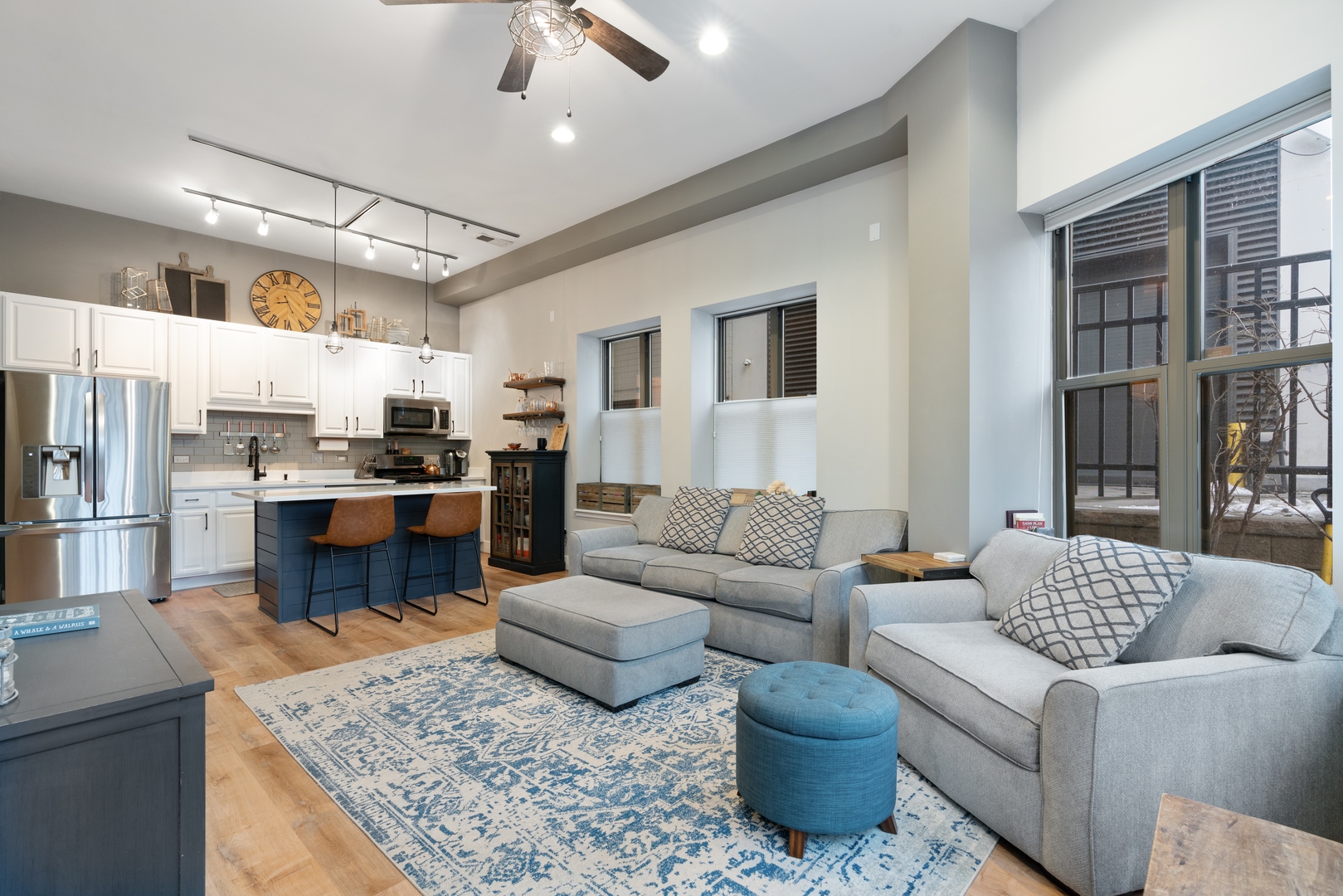 1250 South Indiana Avenue, Unit 101 Chicago, IL 60605 - Photo 5 of 16 a living room with furniture and kitchen view