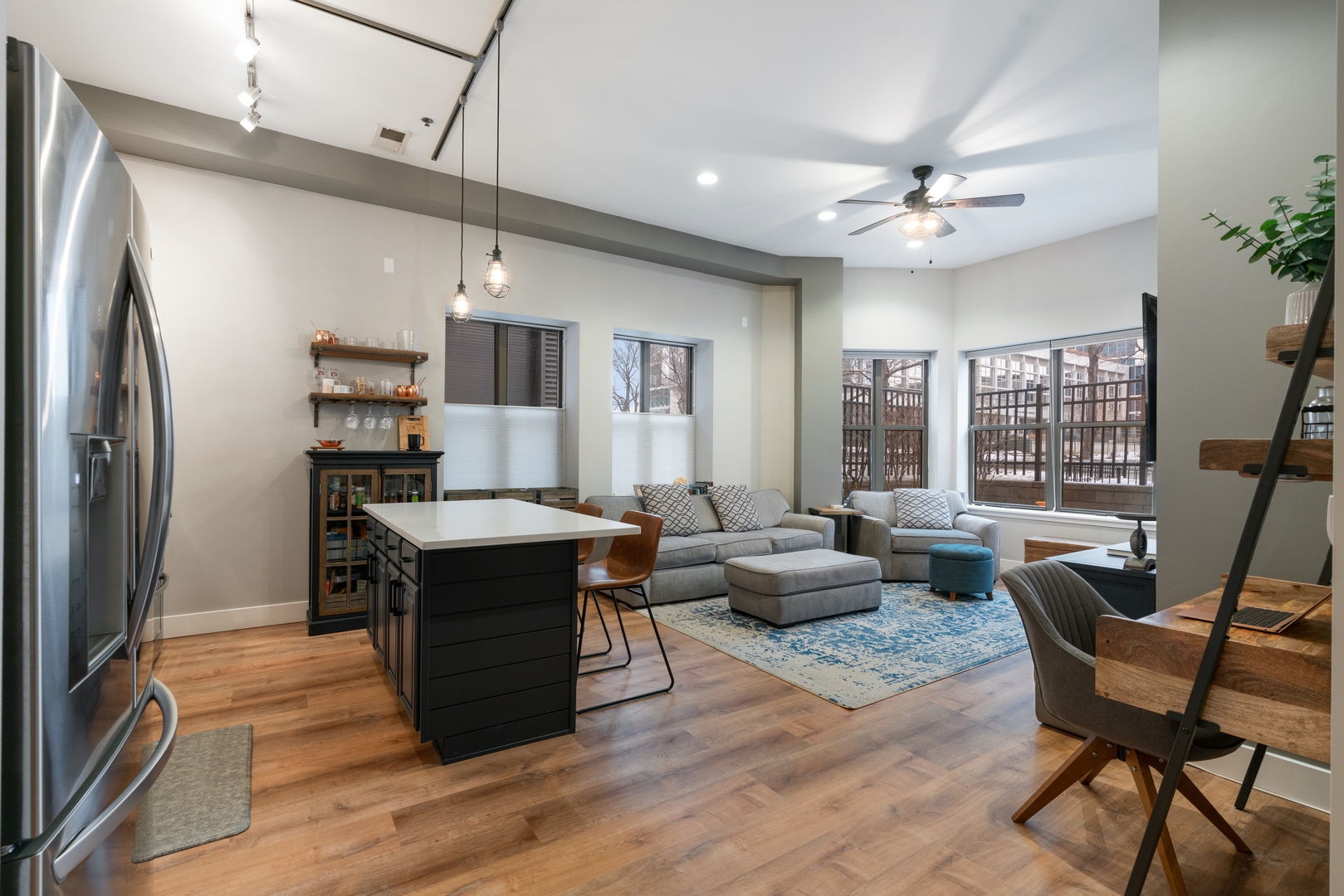 1250 South Indiana Avenue, Unit 101 Chicago, IL 60605 - Photo 6 of 16 a living room with furniture and a flat screen tv