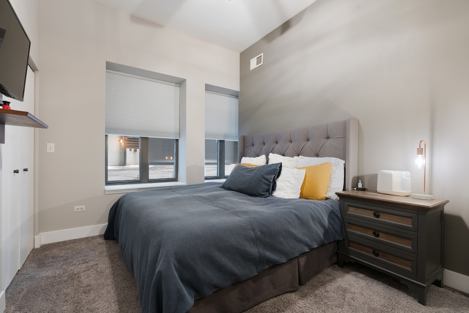 1250 South Indiana Avenue, Unit 101 Chicago, IL 60605 - Photo 10 of 16 a bedroom with a bed and window
