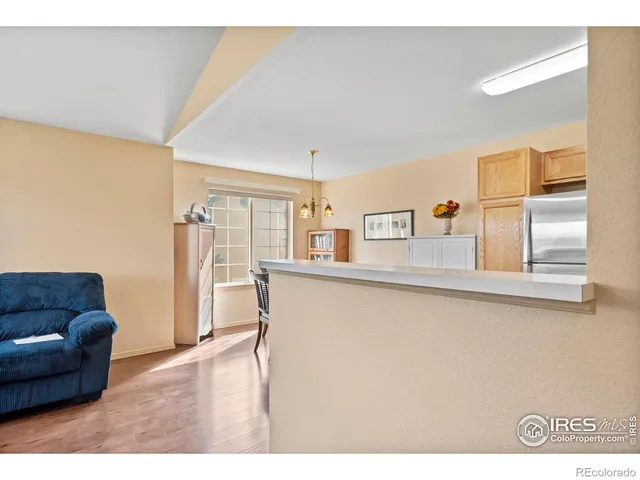 a kitchen with stainless steel appliances granite countertop a refrigerator stove and sink