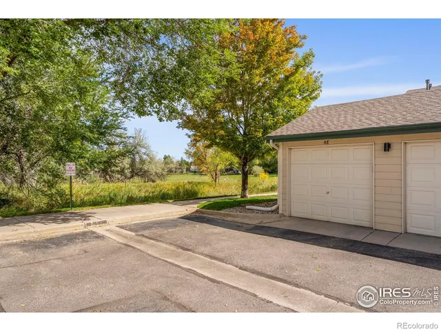 a backyard of a house with wooden fence
