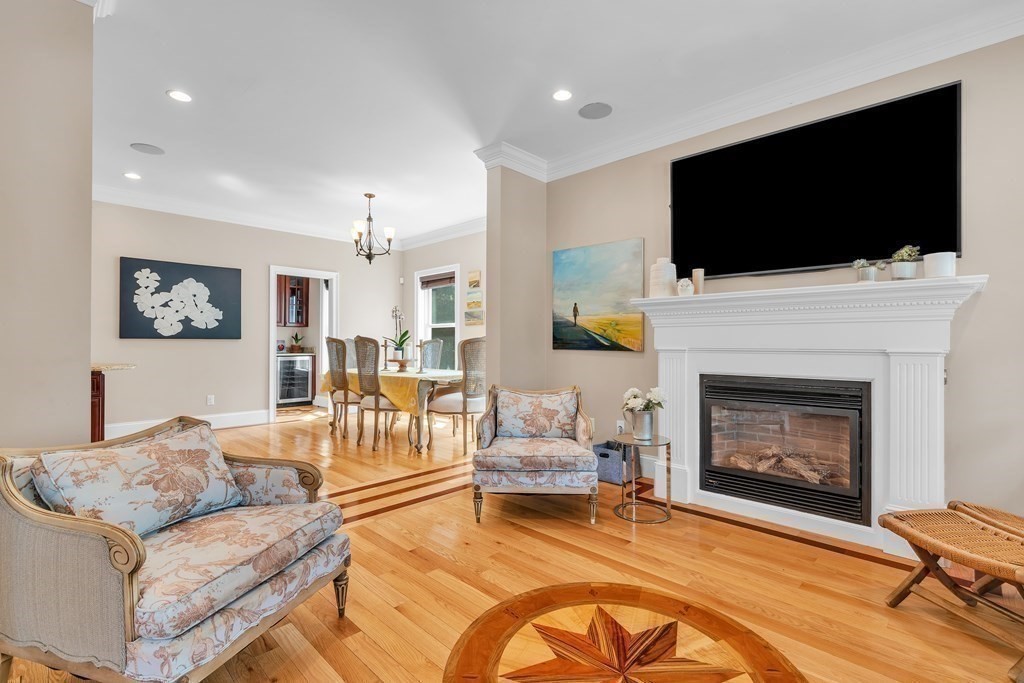 138 Webster Street Needham, MA 02494 - Photo 13 of 29 a living room with furniture a flat screen tv and a fireplace