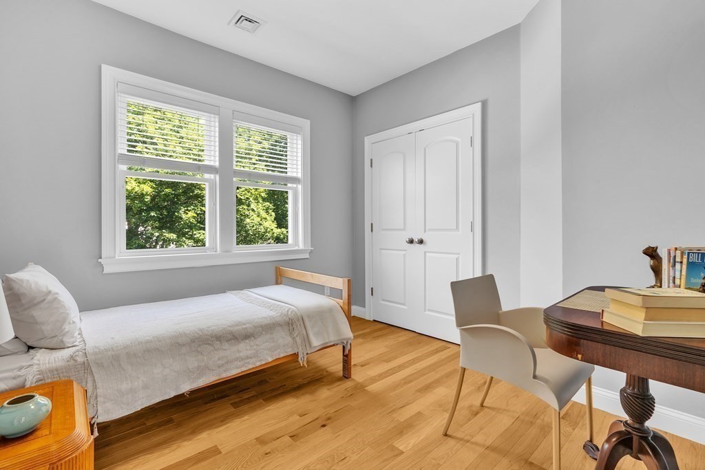 138 Webster Street Needham, MA 02494 - Photo 18 of 29 a bedroom with a bed and a table