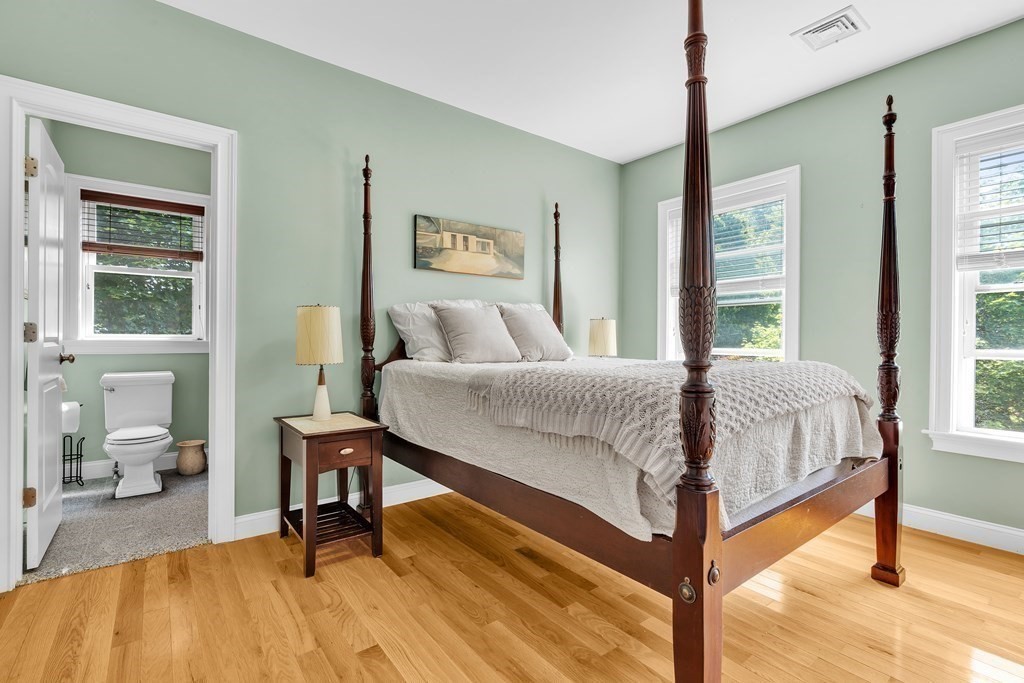 138 Webster Street Needham, MA 02494 - Photo 19 of 29 a bedroom with a bed and a table in it