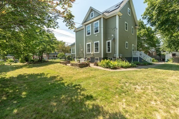 138 Webster Street Needham, MA 02494 - Photo 2 of 29 a front view of a house with a yard
