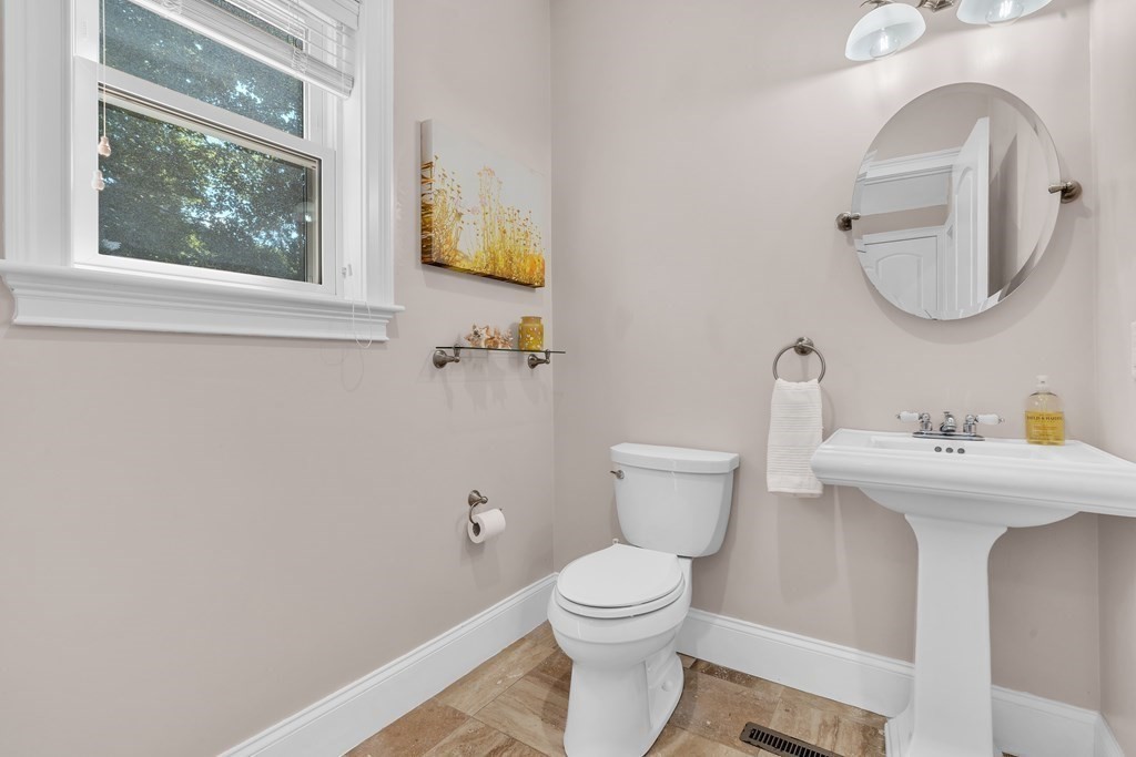 138 Webster Street Needham, MA 02494 - Photo 23 of 29 a bathroom with a toilet a sink and mirror