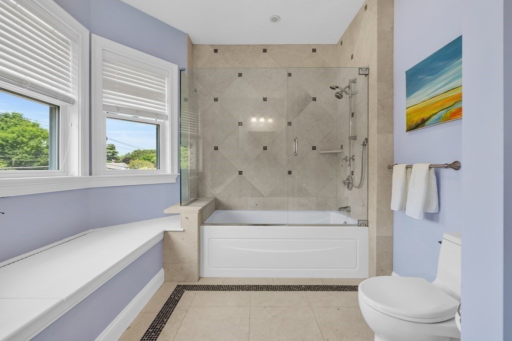 138 Webster Street Needham, MA 02494 - Photo 24 of 29 a bathroom with a bathtub and a toilet