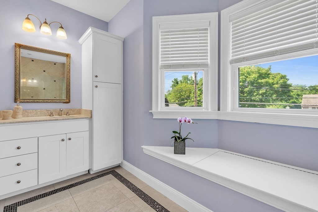 138 Webster Street Needham, MA 02494 - Photo 25 of 29 a bathroom with a sink and a mirror