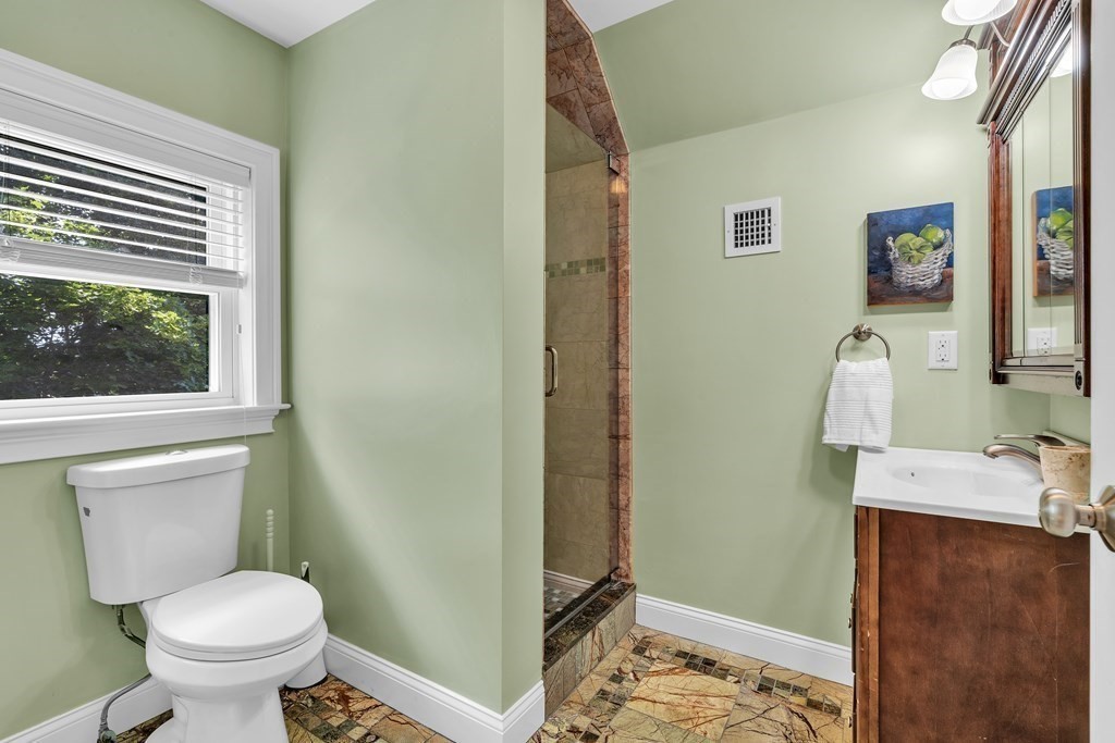138 Webster Street Needham, MA 02494 - Photo 27 of 29 a bathroom with a toilet sink and shower