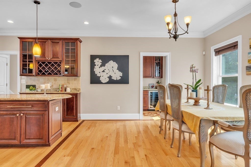 138 Webster Street Needham, MA 02494 - Photo 9 of 29 a view of dining room and kitchen with wooden floor