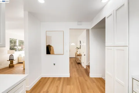 a view of living room with furniture and a wooden floor