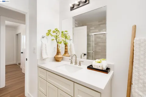 a bathroom with a sink a vanity and a mirror