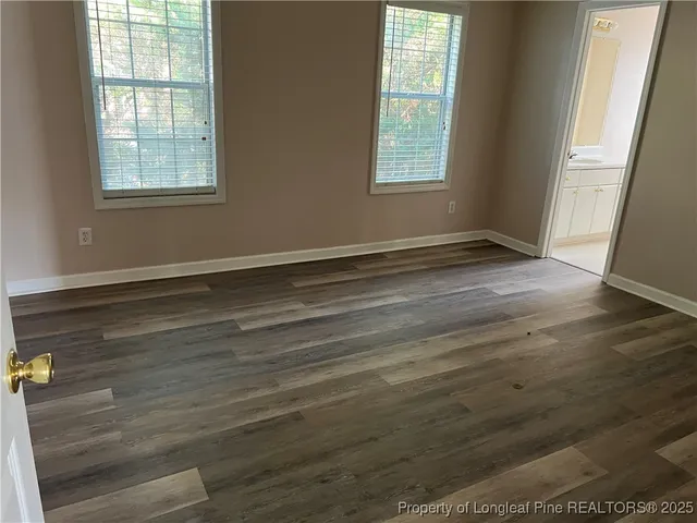 a kitchen with white cabinets sink and white appliances