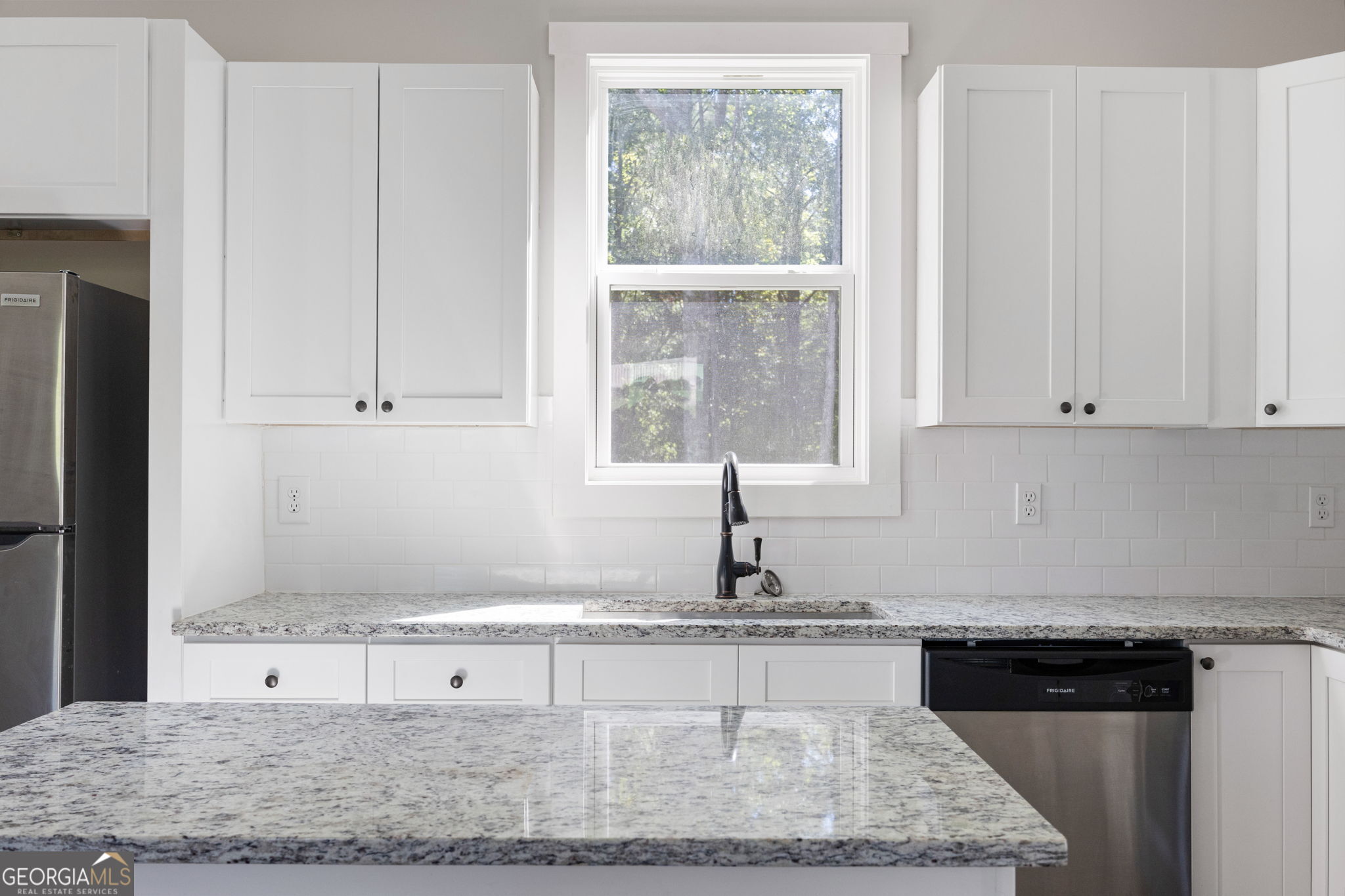 205 Pinecrest Road Cedartown, GA 30125 - Photo 13 of 27 a kitchen with granite countertop a sink and white cabinets