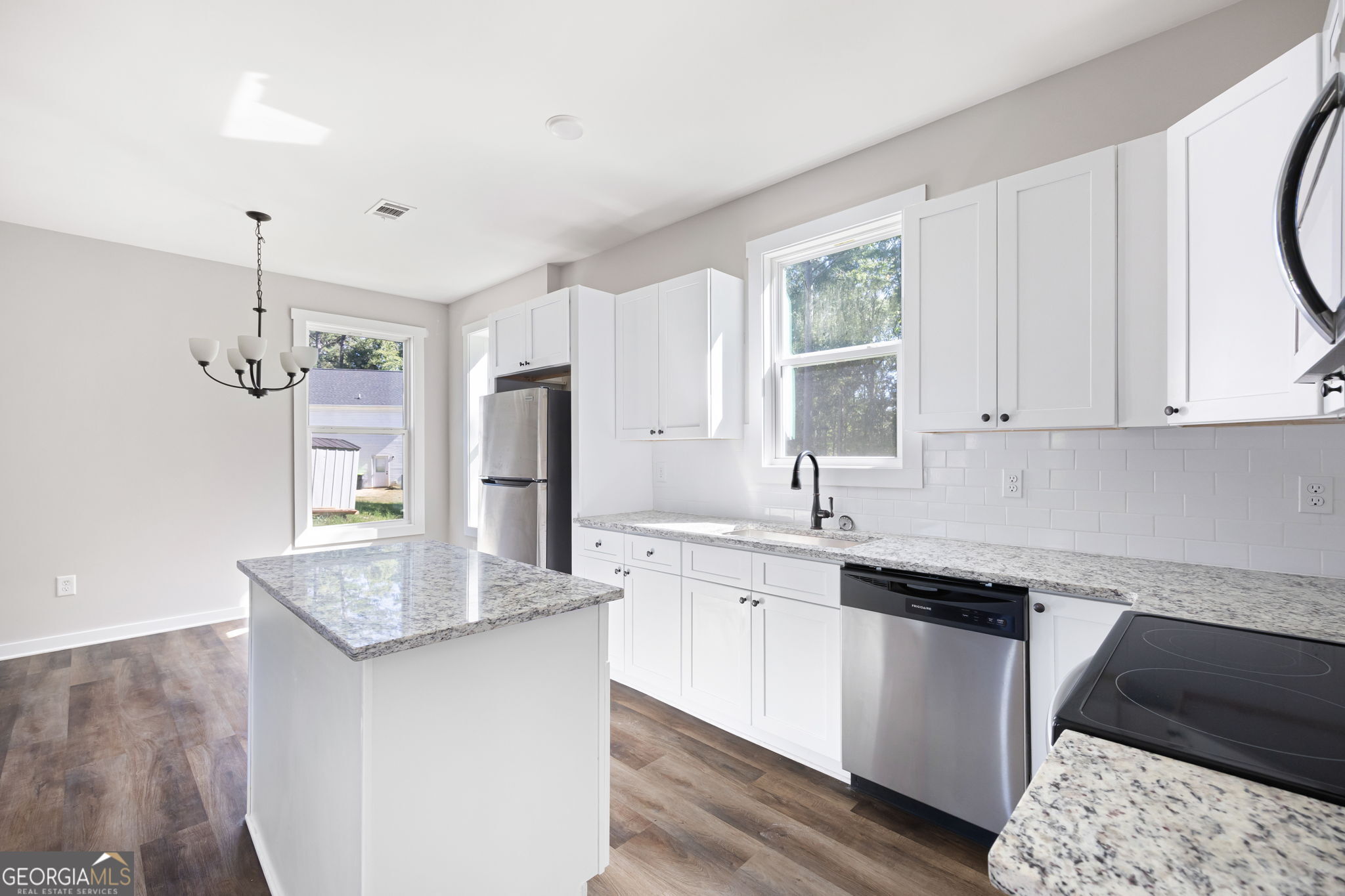 205 Pinecrest Road Cedartown, GA 30125 - Photo 14 of 27 a kitchen with stainless steel appliances granite countertop a sink stove and refrigerator