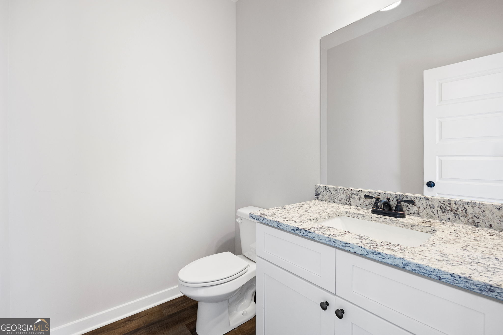 205 Pinecrest Road Cedartown, GA 30125 - Photo 16 of 27 a bathroom with a granite countertop toilet and sink