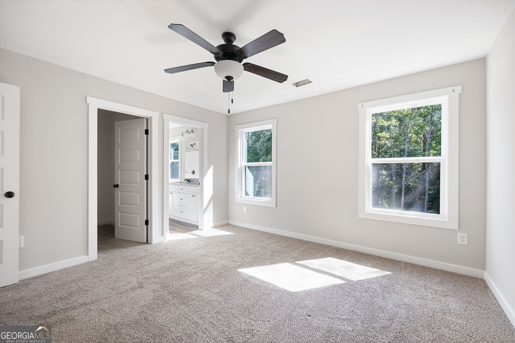205 Pinecrest Road Cedartown, GA 30125 - Photo 18 of 27 an empty room with a ceiling fan and a window