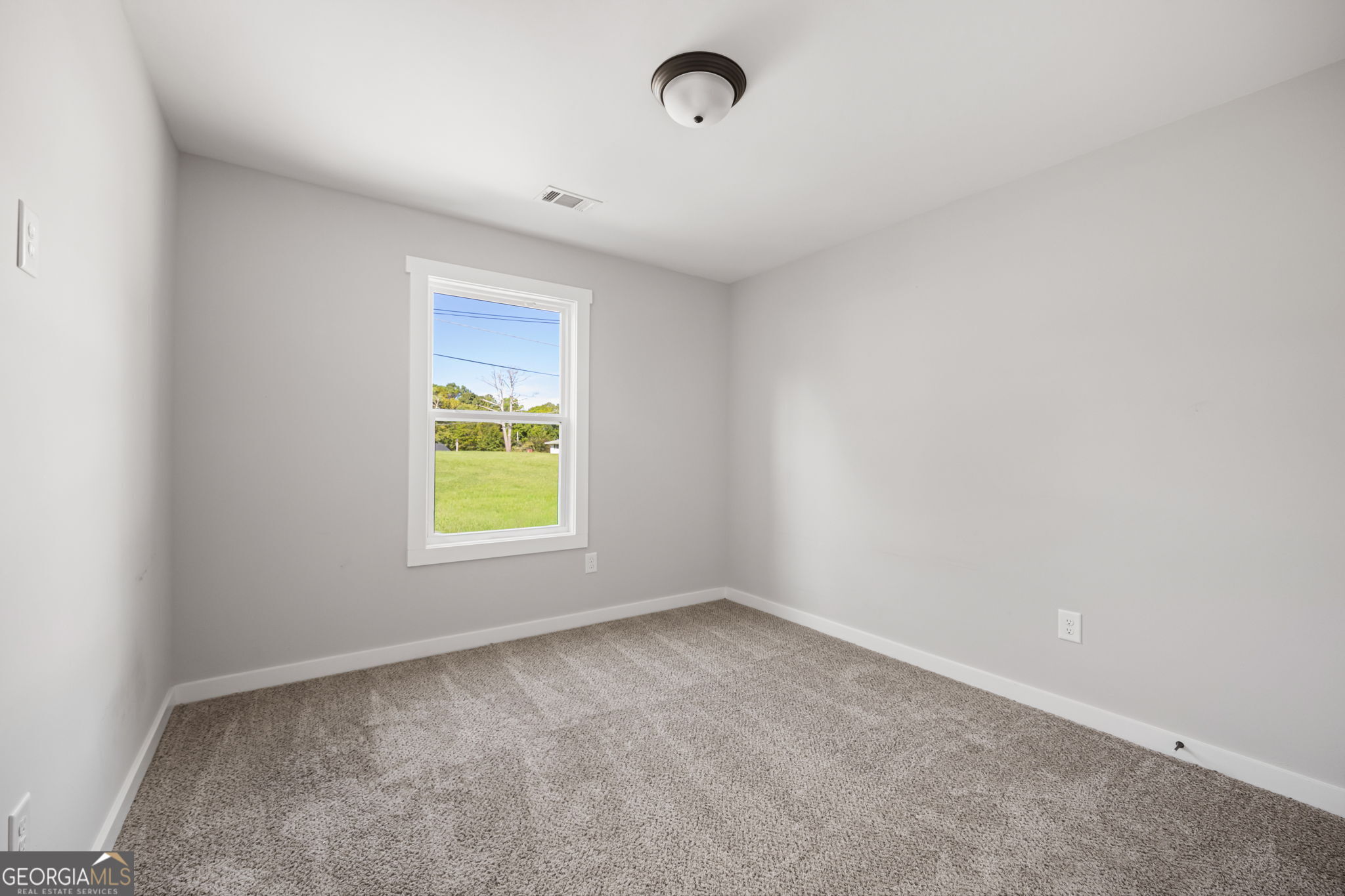 205 Pinecrest Road Cedartown, GA 30125 - Photo 23 of 27 an empty room with a window