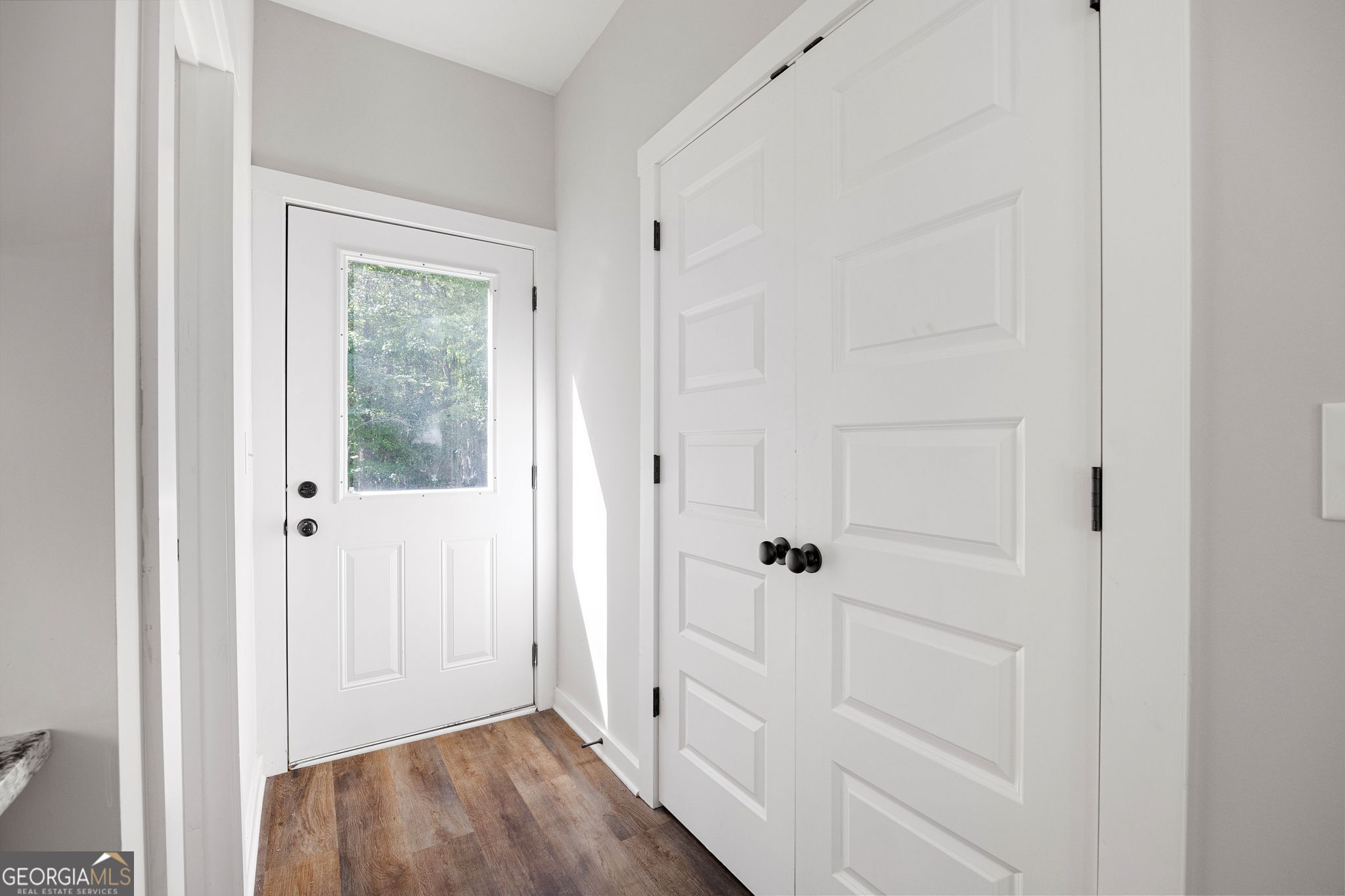 205 Pinecrest Road Cedartown, GA 30125 - Photo 25 of 27 a view of a hallway with wooden floor and closet area