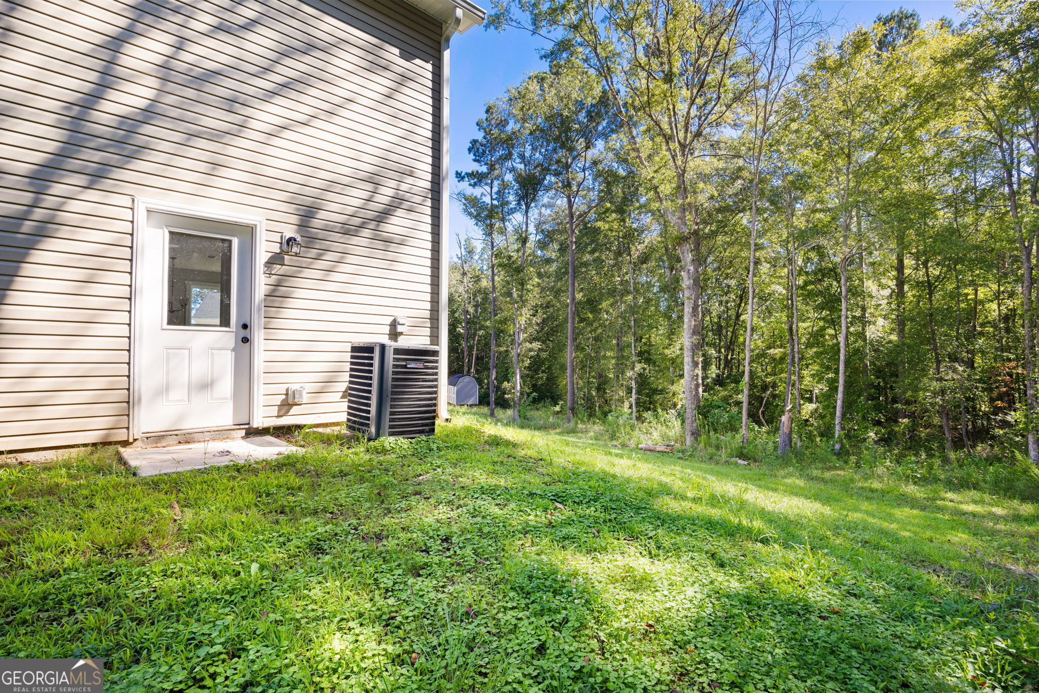 205 Pinecrest Road Cedartown, GA 30125 - Photo 26 of 27 a view of a backyard with plants and large tree