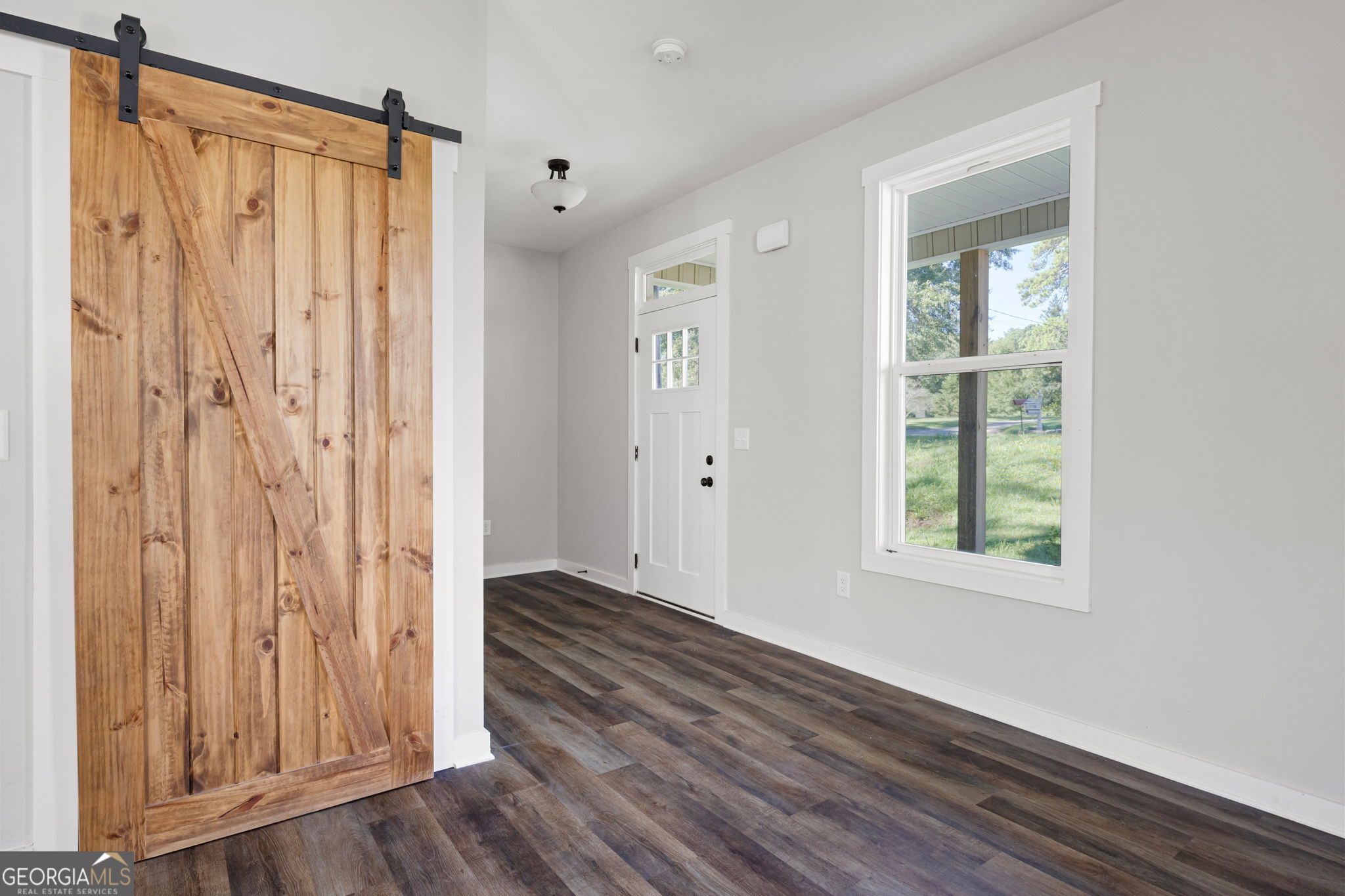 205 Pinecrest Road Cedartown, GA 30125 - Photo 6 of 27 a view of a room with wooden floor and a window