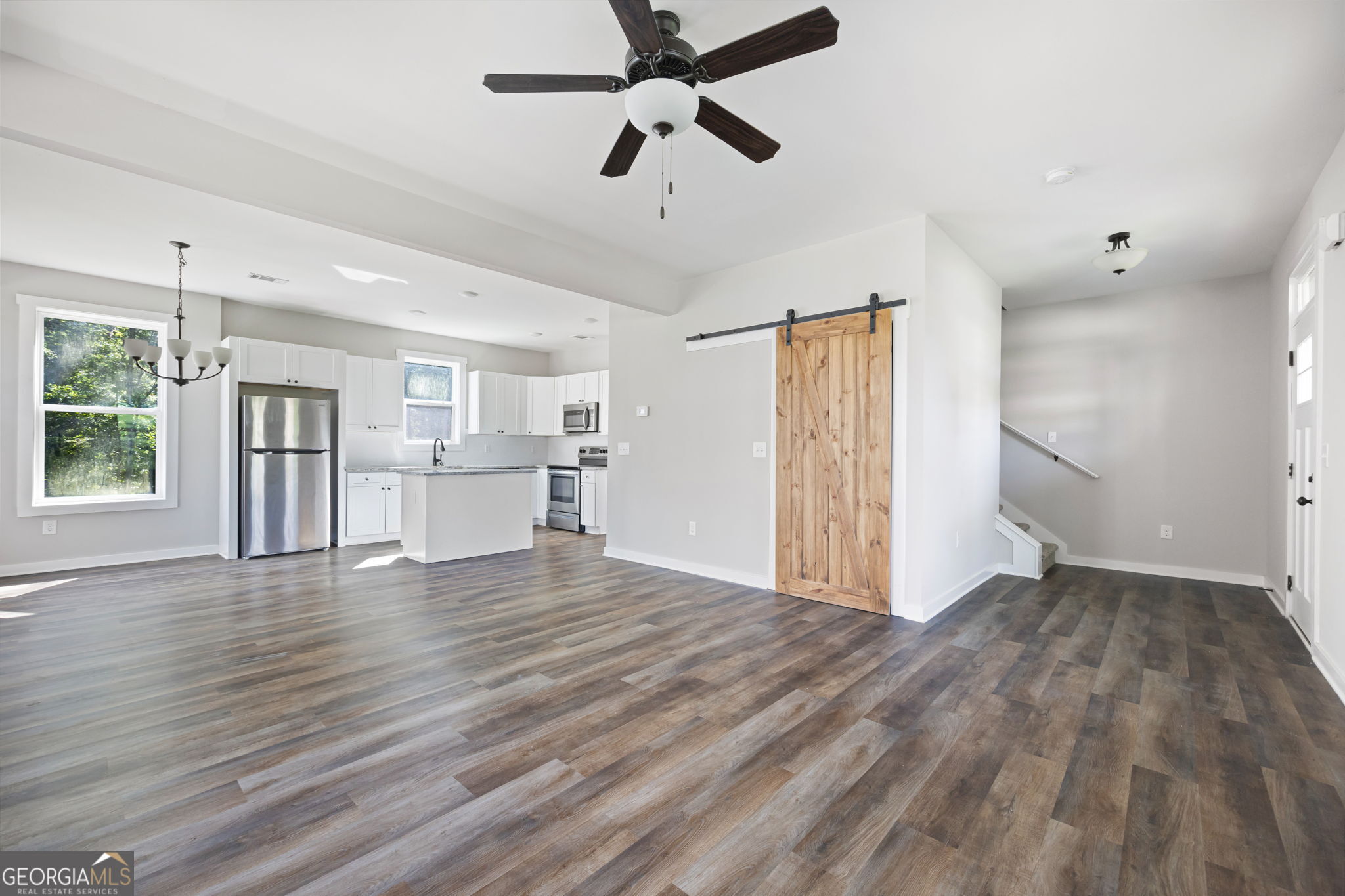 205 Pinecrest Road Cedartown, GA 30125 - Photo 7 of 27 a view of an empty room with window and wooden floor