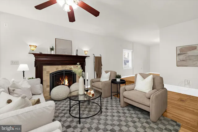 a kitchen with stainless steel appliances granite countertop a refrigerator a sink a stove top oven and a refrigerator